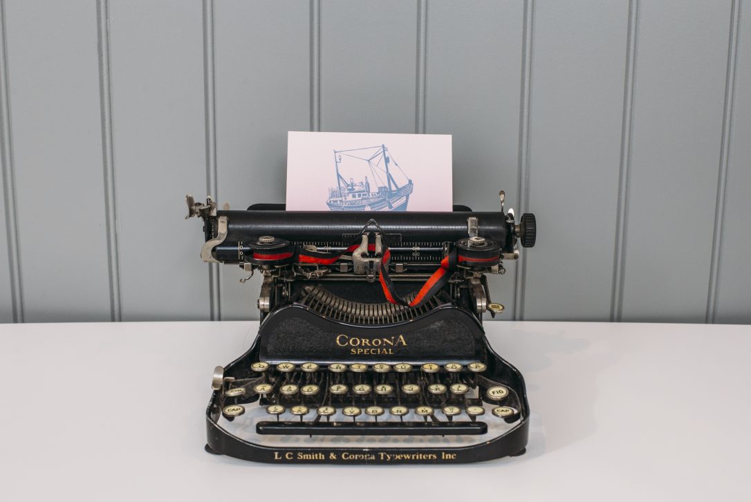 Latitude50 postcard and typewriter