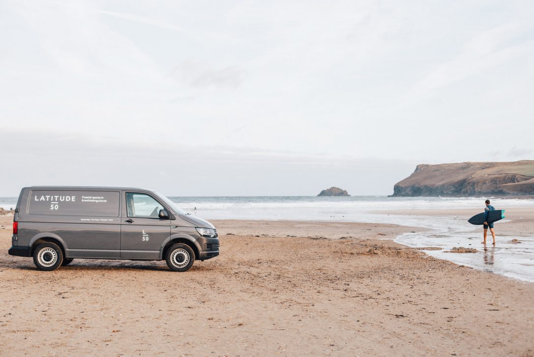 The Latitude50 van and a surfer on Polzeath Beach