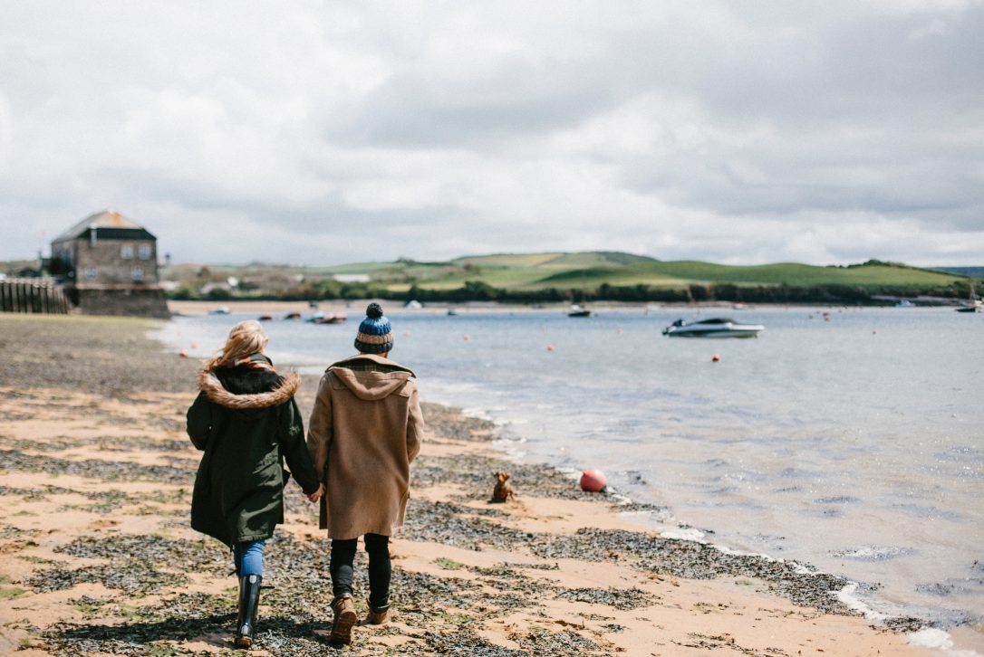 Couple enjoying a winter walk on Rock Beach