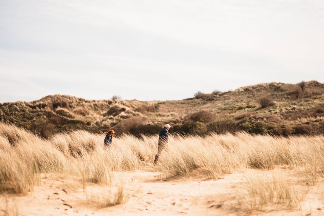 Couple enjoying a winter walk on Rock Beach