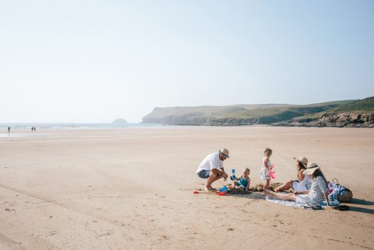 Family enjoying a beach day on Polzeath beach