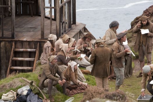 Extras having lunch together on the set of Poldark