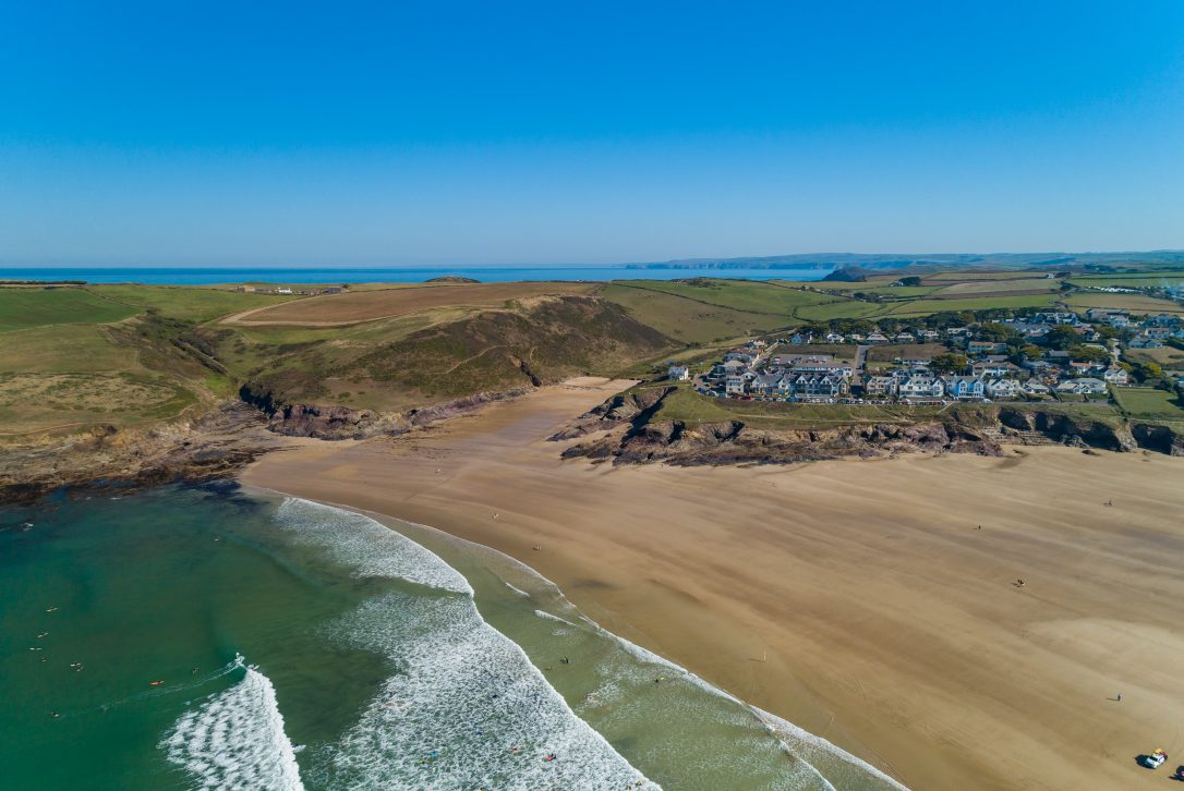 An aerial view of Polzeath Beach and Baby Bay, North Cornwall