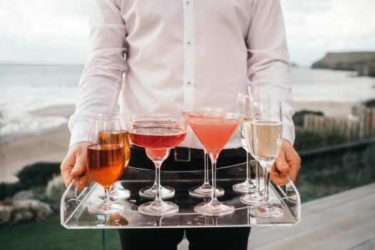 Cocktails on the balcony at Carn Mar, a self-caterinh holiday home above Polzeath beach, North Cornwall