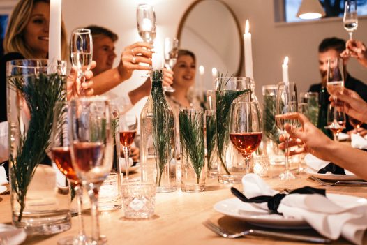 A festive meal around the dining table at Carn Mar, a self-catering holiday home in Polzeath, North Cornwall