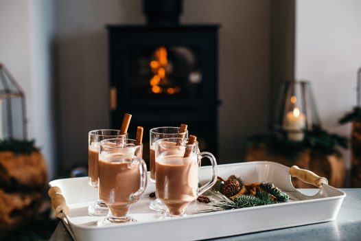 Cups of hot chocolate by the fire at Compit, a self-catering holiday home in Polzeath, North Cornwall