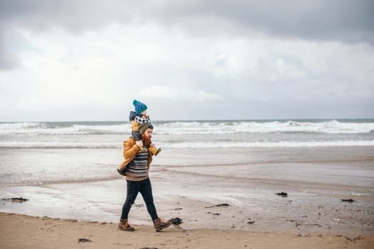 Father and son on Polzeath beach