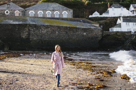 Woman walking on Port Isaac beach