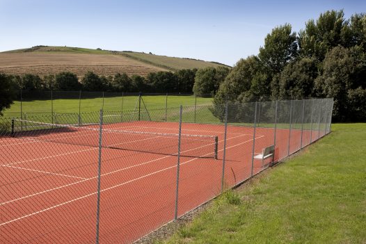 Tennis courts at Cant Farm, a private estate on the banks of the Camel Estuary