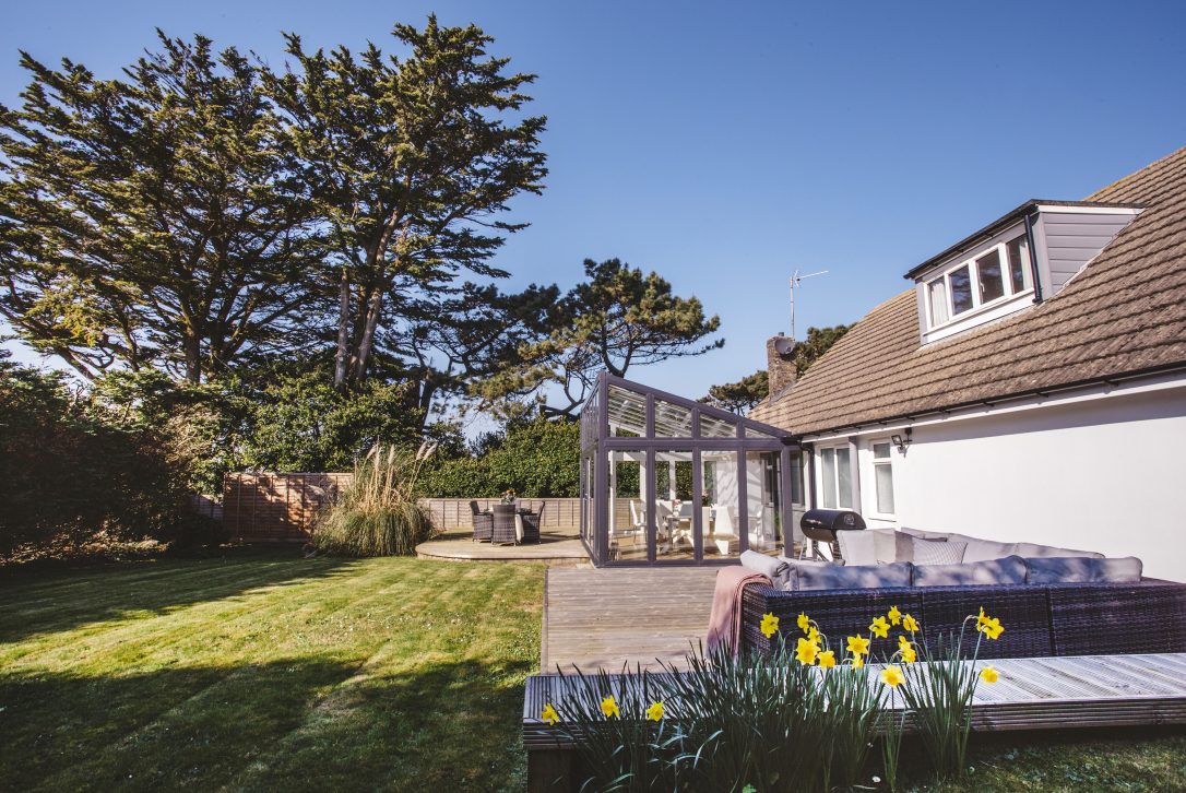 Gardena and exterior of Pinetree Lodge a self-catering holiday home in Polzeath, North Cornwall, available on a low occupancy rate.