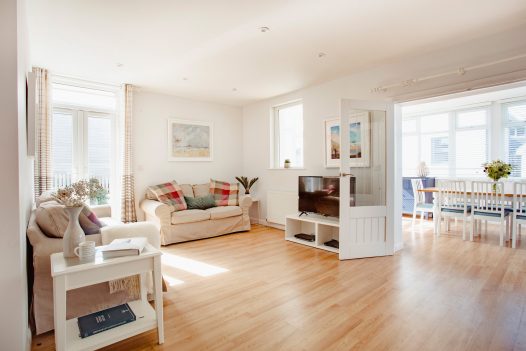 Light and bright lounge at Hillcote a self-catering holiday home in Polzeath, North Cornwall, available on a low occupancy rate.