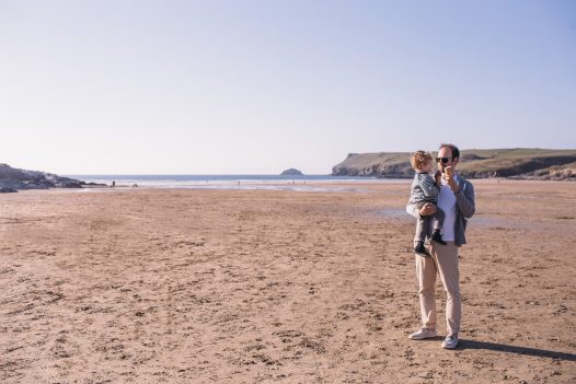 Father and son on Polzeath Beach, North Cornwall