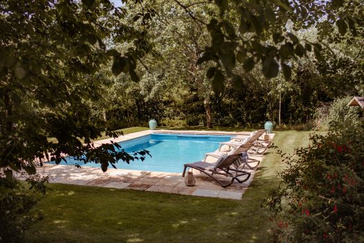 Overlooking the swimming pool and sheltered gardens at Buzza Vean