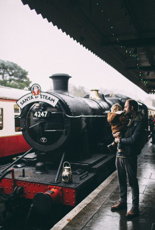 Children boarding the Santa by Steam train at Bodmin General Station, North Cornwall.