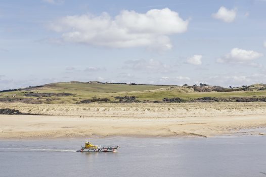 The Padstow to Rock ferry crosses the calm waters of the Camel Estuary