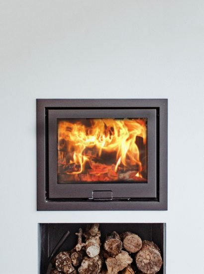 The wood burner at Bowji, a self-catering holiday property in Daymer Bay, North Cornwall