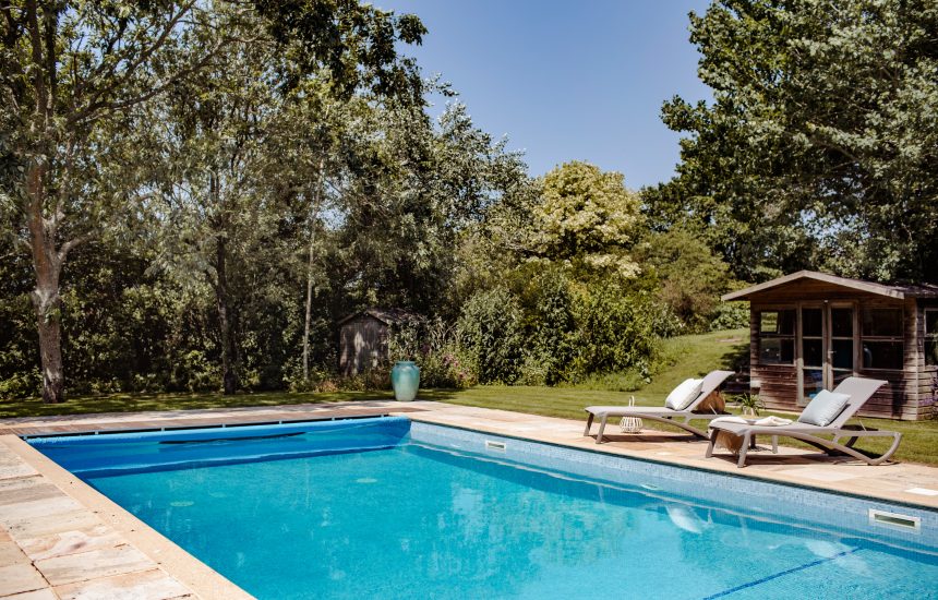 The heated, outdoor swimming pool at Buzza Vean, a self-catering holiday home in Rock, North Cornwall