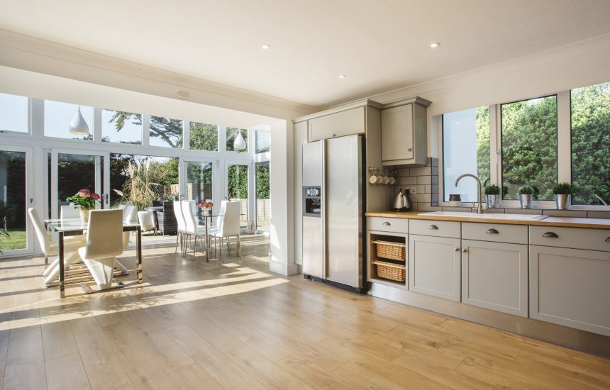 The open plan kitchen and dining area at Pinetree Lodge, a self-catering holiday home in New Polzeath, North Cornwall