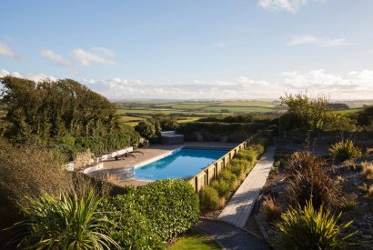 Swimming pool at The Tractor Shed, a self-catering holiday home in Polzeath, North Cornwall