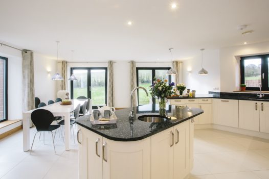 Open plan kitchen and dining room at The Woodshed, a self-catering holiday cottage near Rock, North Cornwall