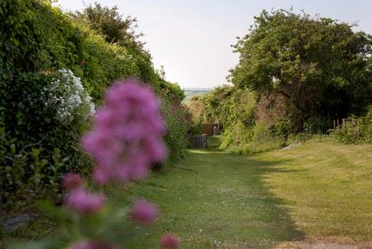 Pathway down to the beach at Little Lynam, a self-catering holiday home in Rock, North Cornwall