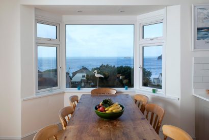 Dining room view at Penroy, a self-catering holiday house in Polzeath, North Cornwall